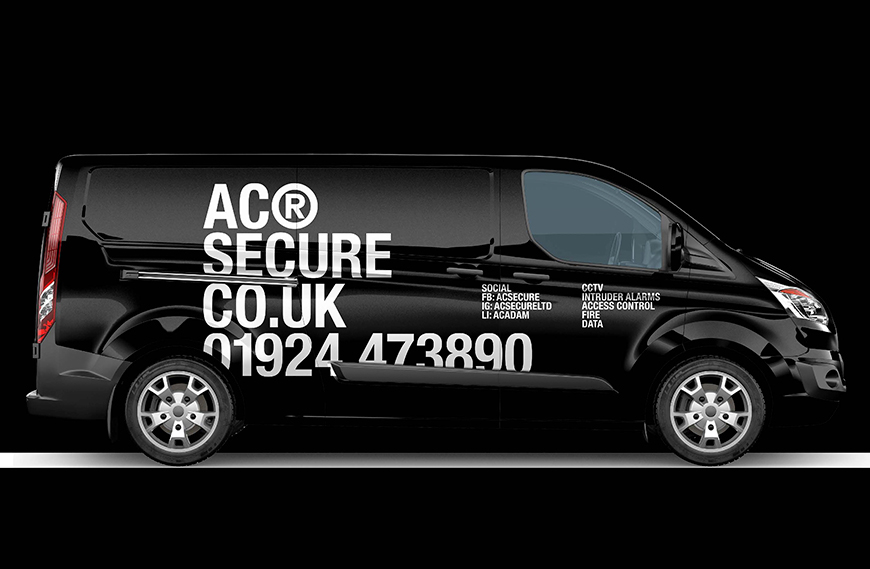 An image with a black van and the AC Secure logo and telephone number on the site.