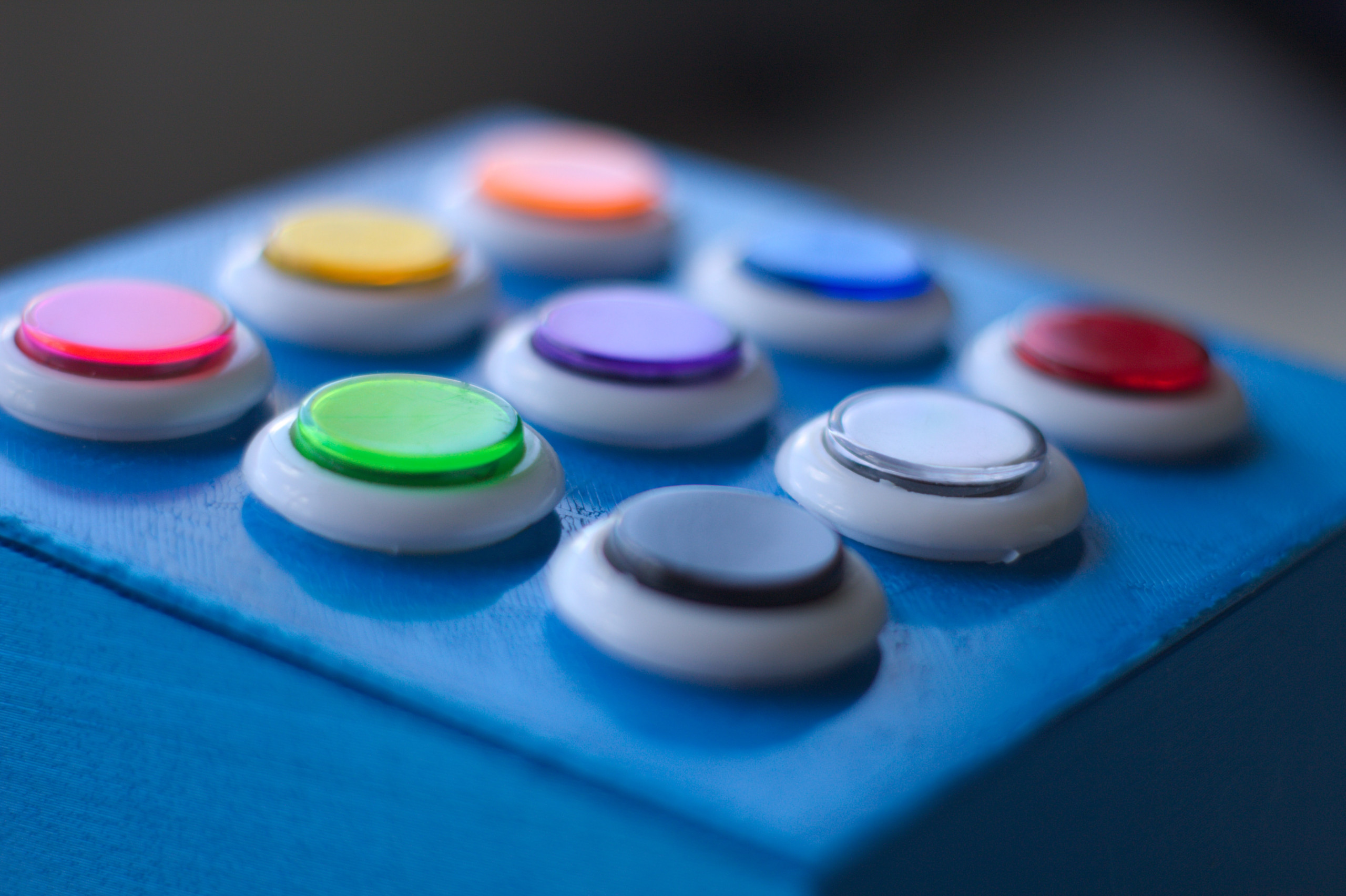 An image with a set of 9 buttons .