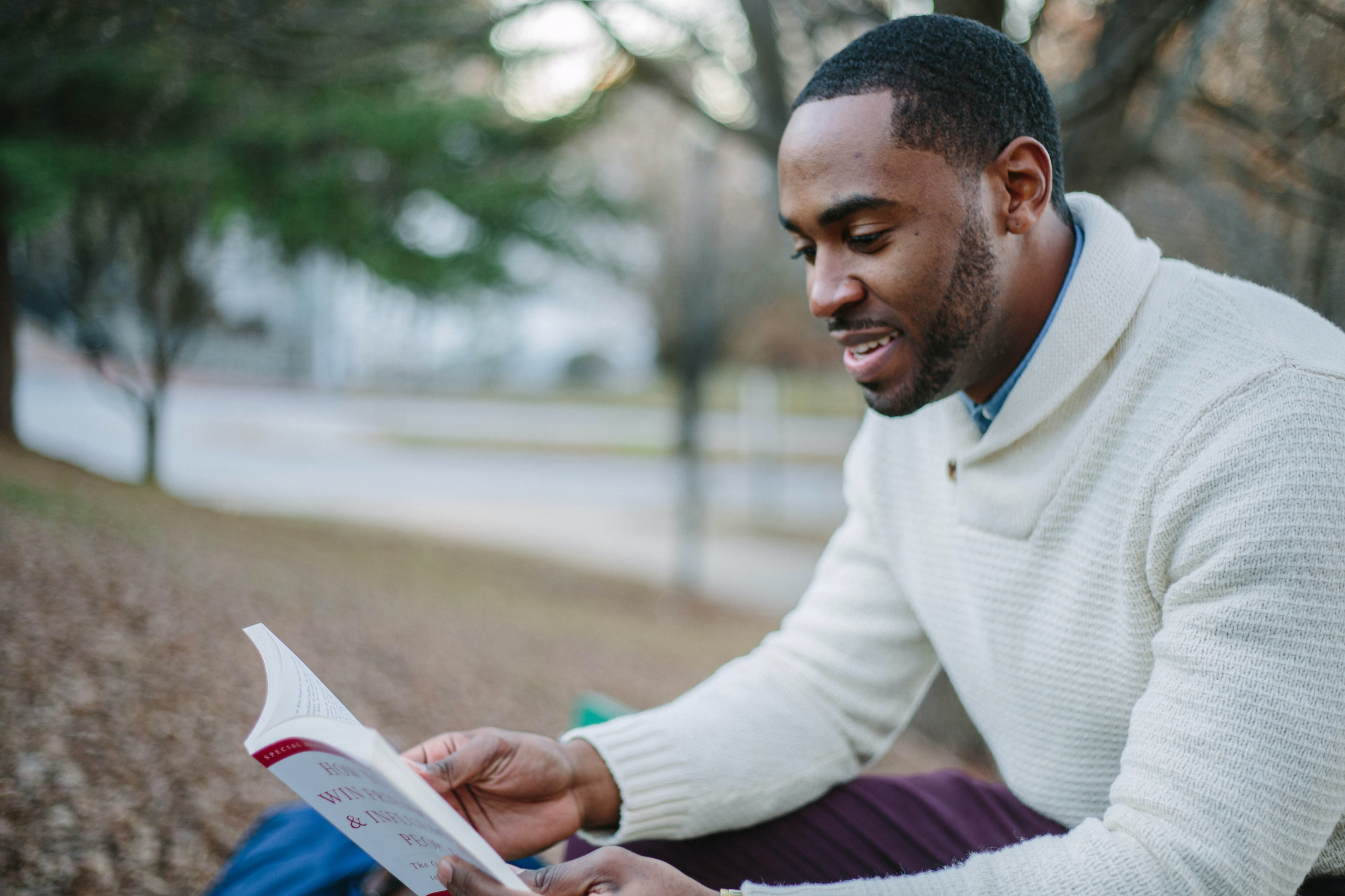 Person sitting down reading a book
